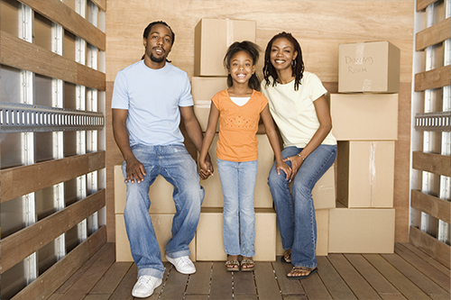 Family In Back Of Moving Truck